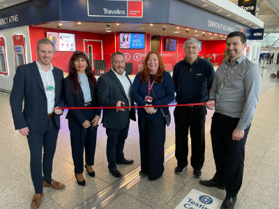 People cutting a ribbon to open a new Travelex store
